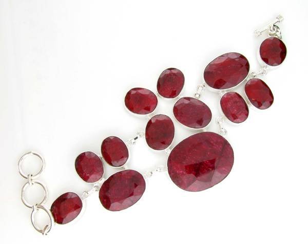 APP: 14k 176CT Oval Cut Ruby & Sterl Silver Bracelet: 176.93CT Oval Cut Ruby and Sterling Silver Bracelet - Appraisal Value: $14.2K <