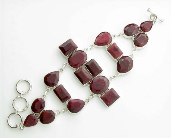 APP: 12k 144CT Mixed Cut Ruby & Sterl Silver Bracelet: 144.40CT Mixed Cut Ruby and Platinum Over Sterling Silver Bracelet - Appraisal Value: $12.1K
