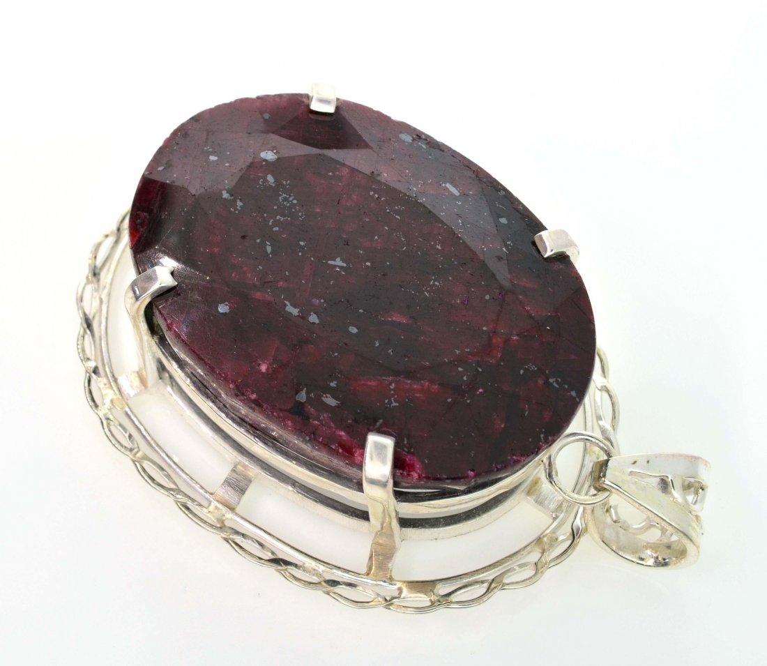 APP: 15k Sebastian 377CT Oval Cut Ruby & Silver Pendant: Designer Sebastian 377.24CT Oval Cut Ruby and Sterling Silver Pendant - Appraisal Value: $15.9K