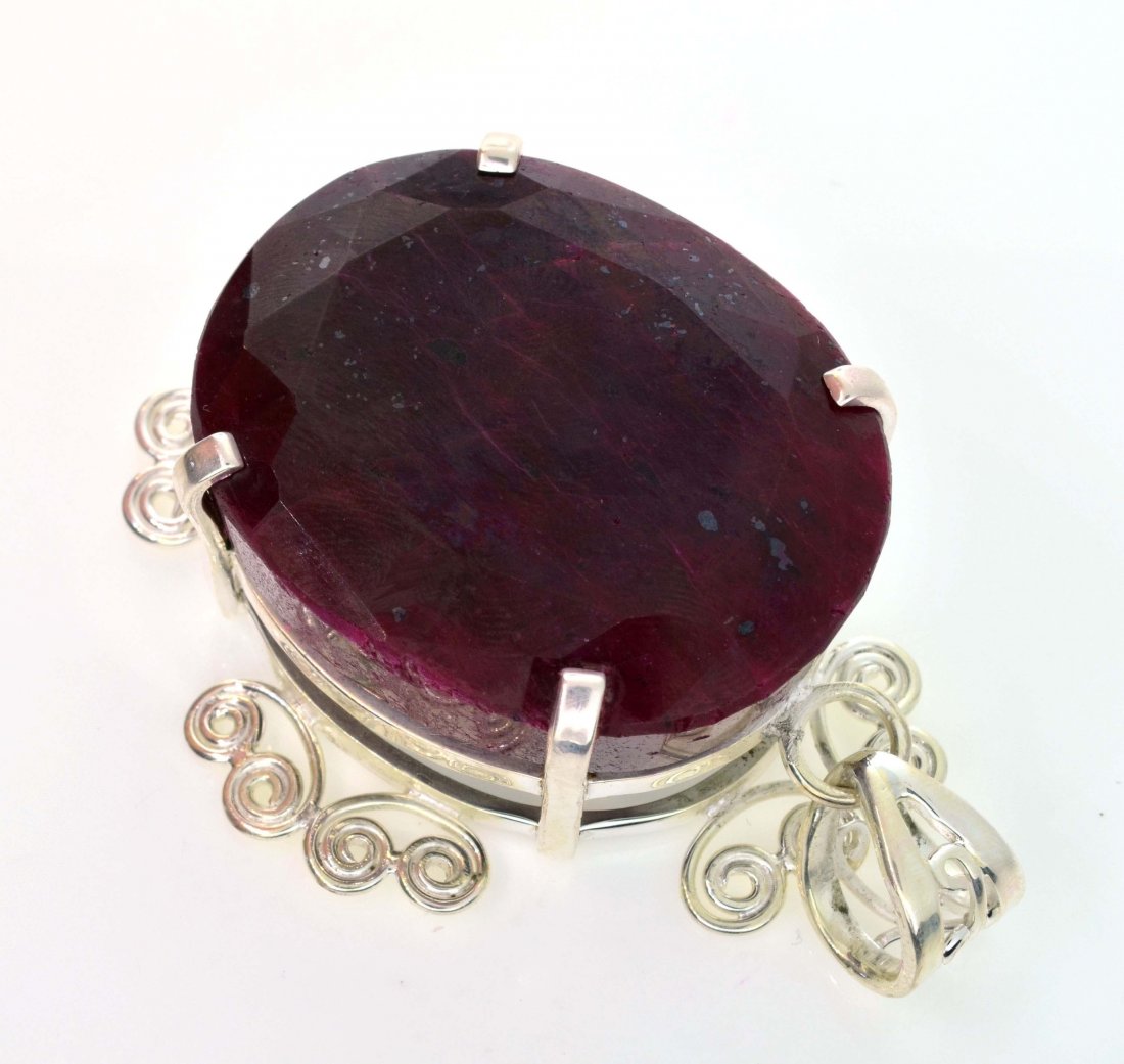 APP: 14k Sebastian 344CT Oval Cut Ruby & Silver Pendant: Designer Sebastian 344.93CT Oval Cut Ruby and Sterling Silver Pendant - Appraisal Value: $14.7K