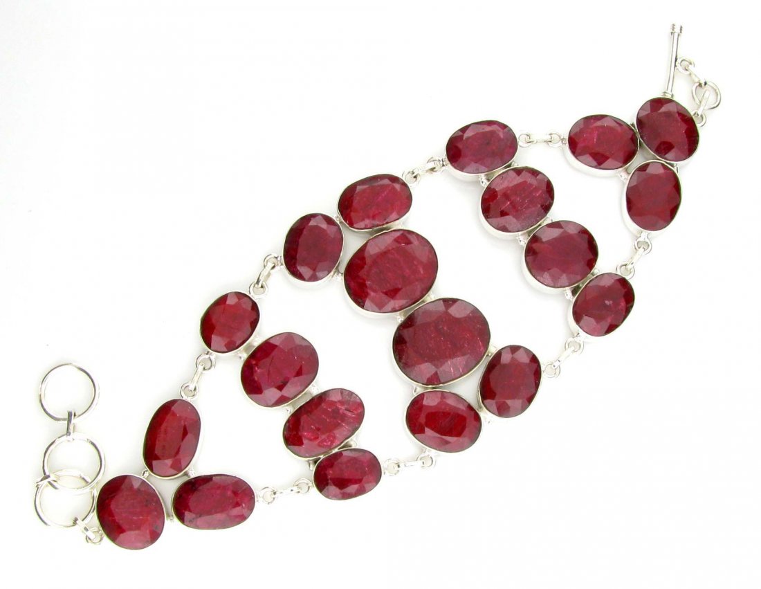APP: 14k 166CT Oval Cut Ruby & Sterl Silver Bracelet: 166.40CT Oval Cut Ruby and Sterling Silver Bracelet Retail R
