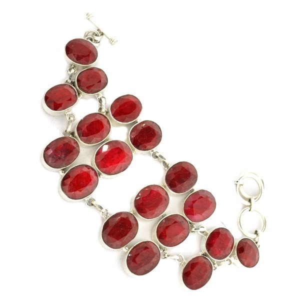 APP: 15k 138CT Oval Cut Ruby & Sterl Silver Bracelet: 138.72CT Oval Cut Ruby and Sterling Silver Bracelet Retail R