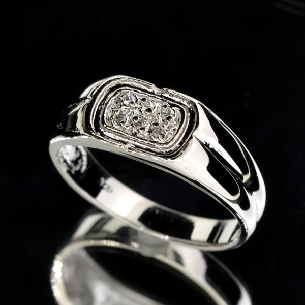 0CT Round Cut Diamond & Silver Rolex Style Ring: 0.04CT Round Cut Diamond and Platinum Over Ste