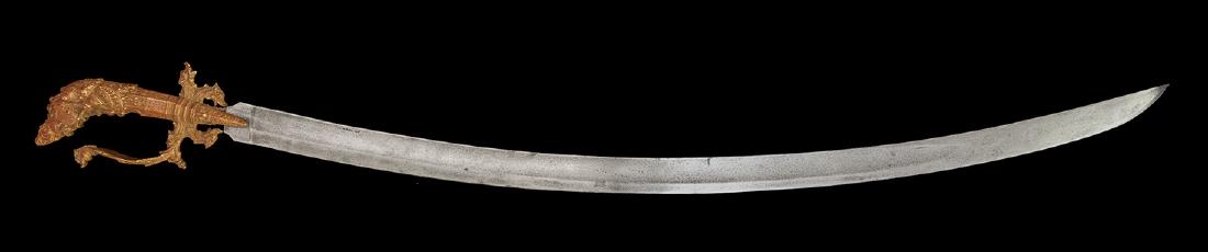 A CEYLON SABRE SWORD, 19TH-20TH CENTURY, SWORD: Origin: Ceylon. Length - 97,8 cm. Weight â€“ 1074 g. Blade:Curved steel blade with one wide fuller, double edged near the tip. Length of the blade â€“ 81,5 cm, width â€“ 34 mm, thicknes