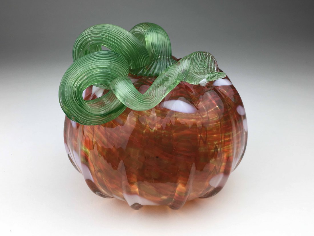 Fenton Orange and White Pumpkin: This Fenton Pumpkin is Orange in color and has white spots through out. The stem of the pumpkin is light green. Pumpkin is also signed and dated on the bottom.5x6x6