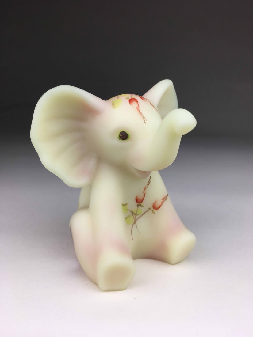 Fenton Hand Painted Elephant: This Fenton Elephant is peach in color with hand painted red roses through out. Is marked Fenton and is signed by the artist.(4x3x3)