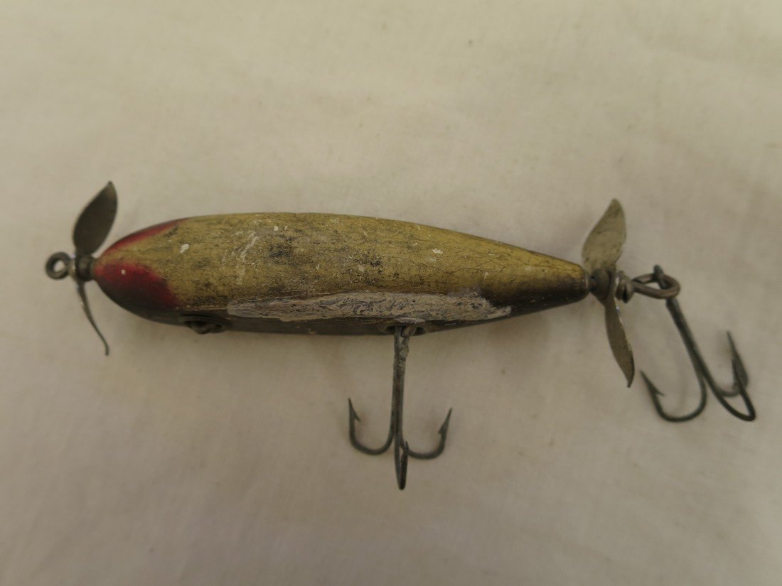 Antique wooden fishing lure.: Antique wooden fishing lure, missing one hook.