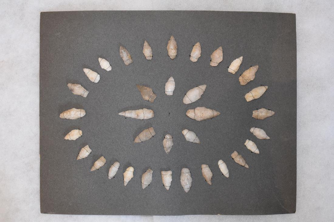 Bank Window lot of New England Arrowheads: This is a frame of arrowheads that was displayed in the early 1900's in the bank window of the Boston Federal Way in Boston MA. The cardboard frame and wired arrowheads makes a nice display. The cardb