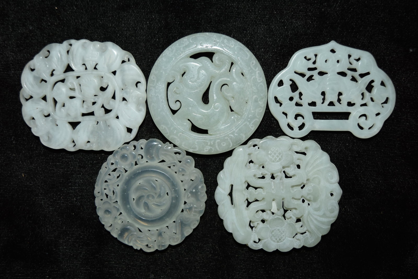 Five Chinese carved jadeite hard stone medallions: Five Chinese carved jadeite hard stone medallions