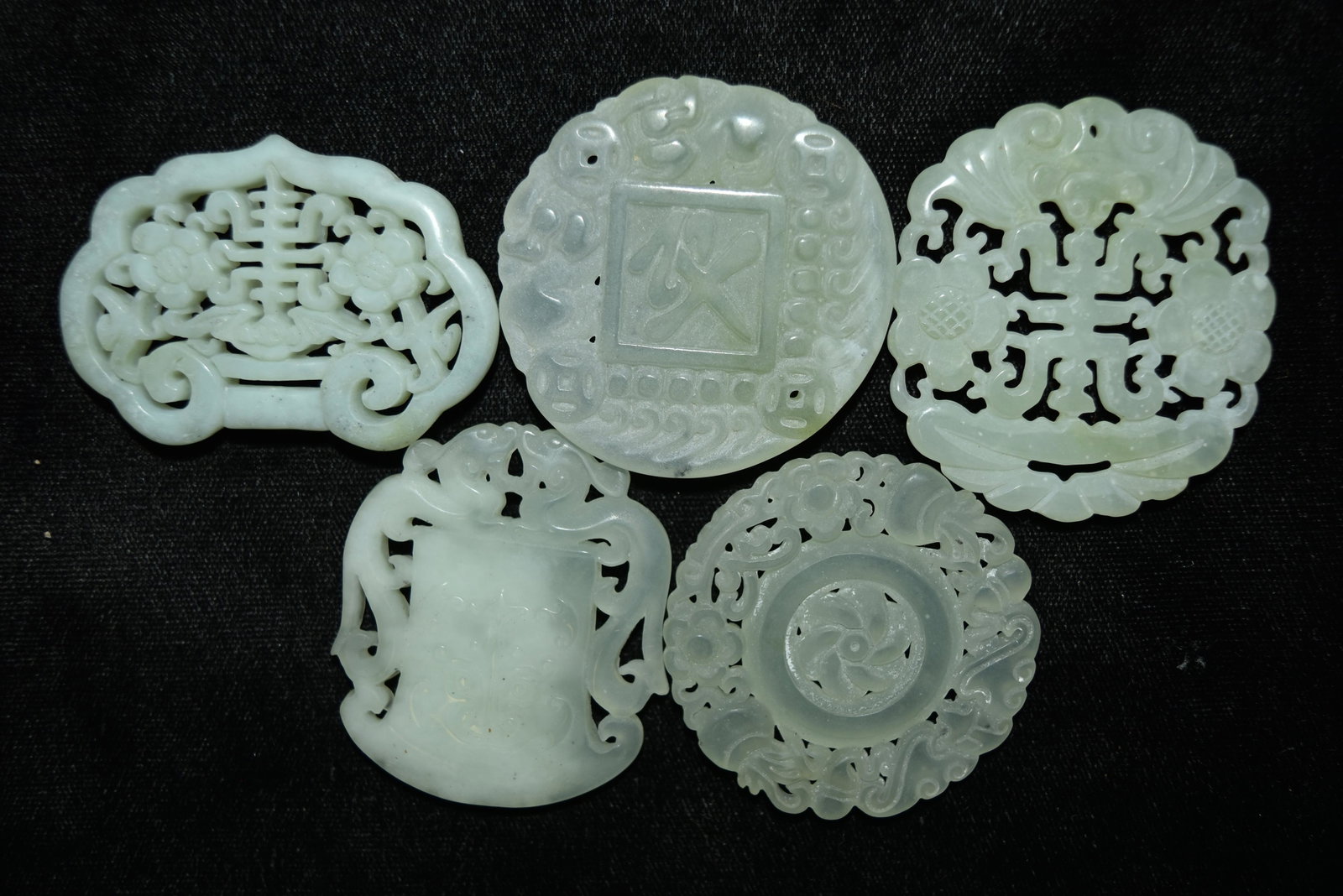 Five Chinese carved jadeite hard stone medallions: Five Chinese carved jadeite hard stone medallions
