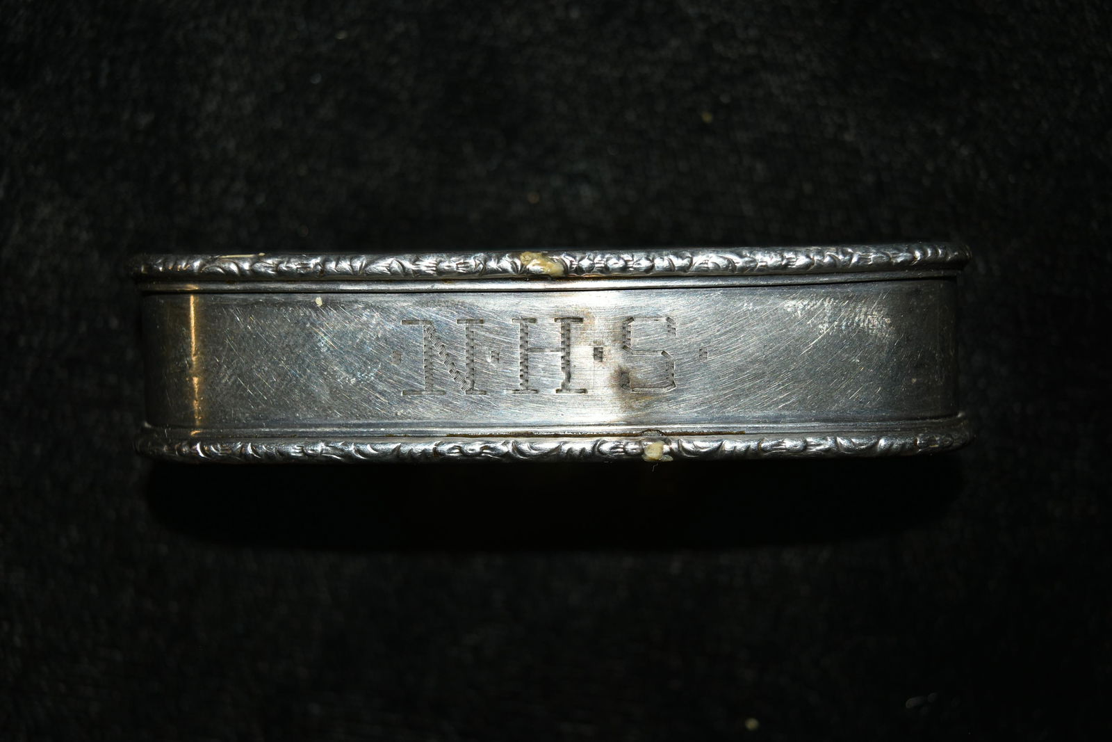 Antique Sterling Napkin Ring With Decorated Boarders.: Antique Sterling Napkin Ring With Decorated Boarders. 25.5 Grams. Measures 3"