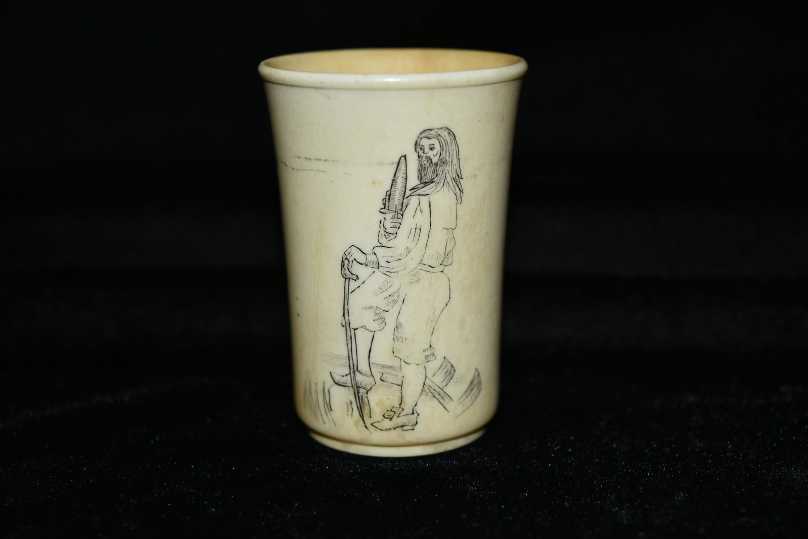 Scrimshaw shot glass of pirate. Made of horn.: Scrimshaw shot glass of pirate. Made of horn. Measures 2 1/2"