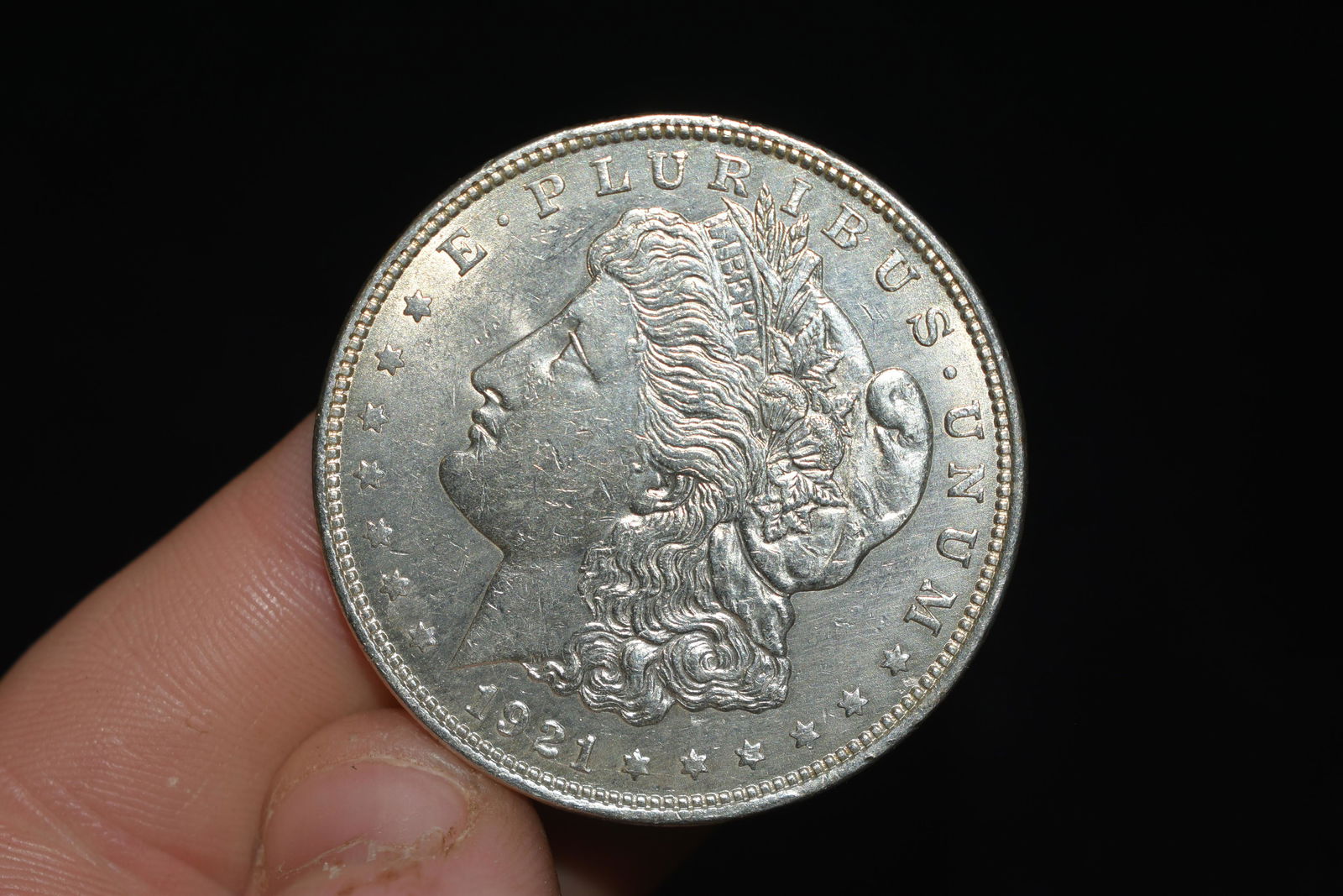 Gem Bu 1921 Morgan silver dollar.  Please grade by (1 of 3)