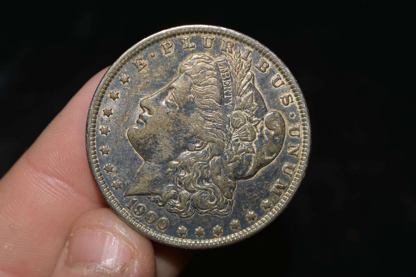 High grade 1900 Morgan Silver Dollar.  Please grade by (1 of 3)