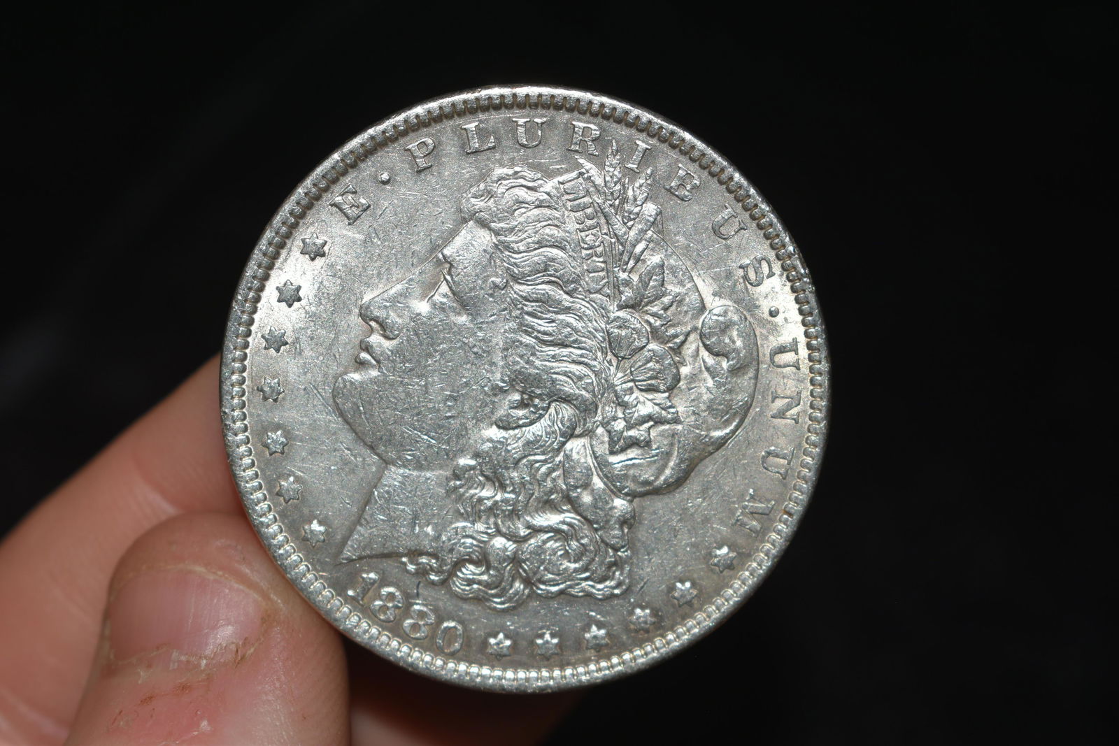 High grade 1880 Morgan Silver Dollar.  Please grade by (1 of 3)