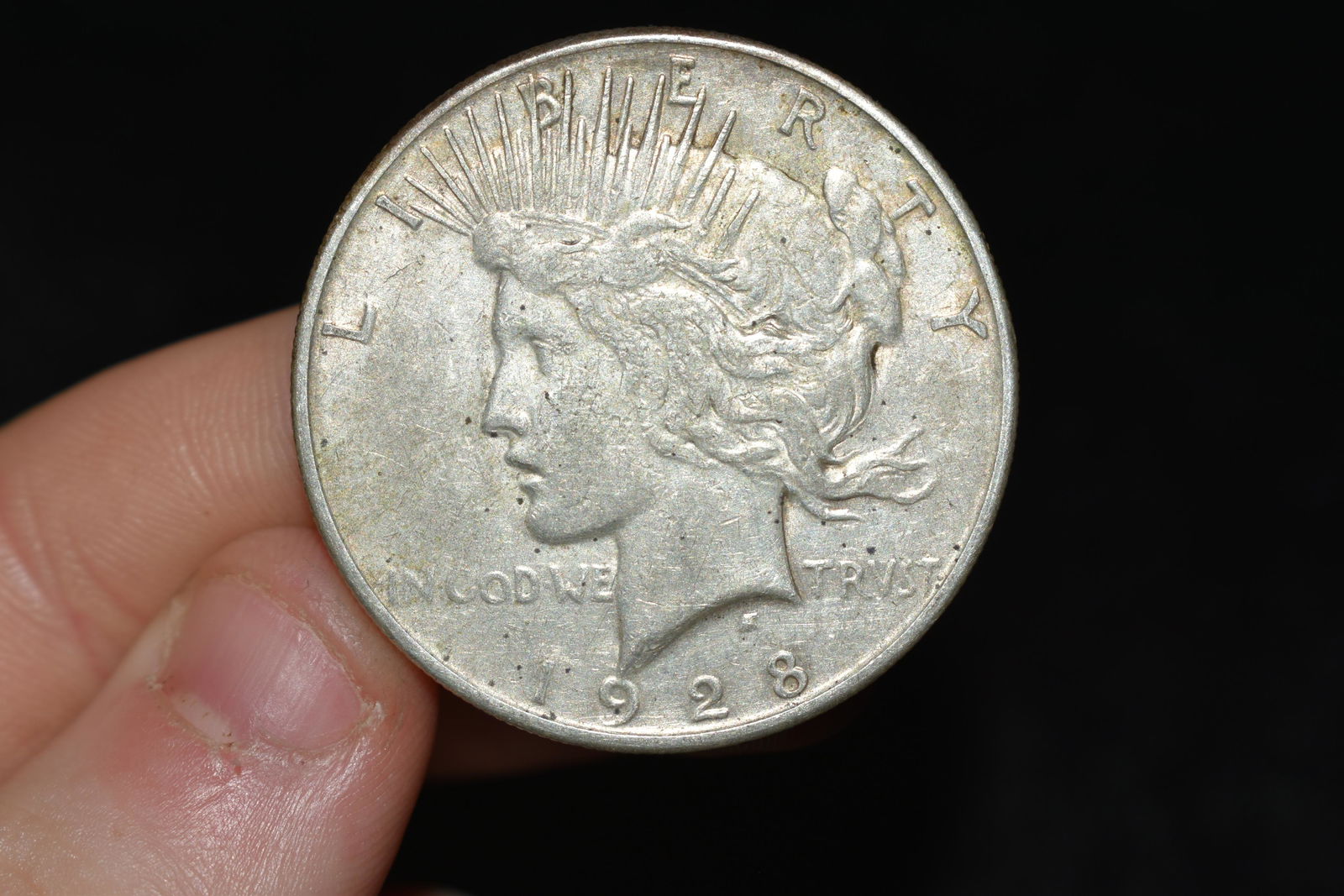 Nice looking 1928s peace dollar.  Please use (1 of 2)