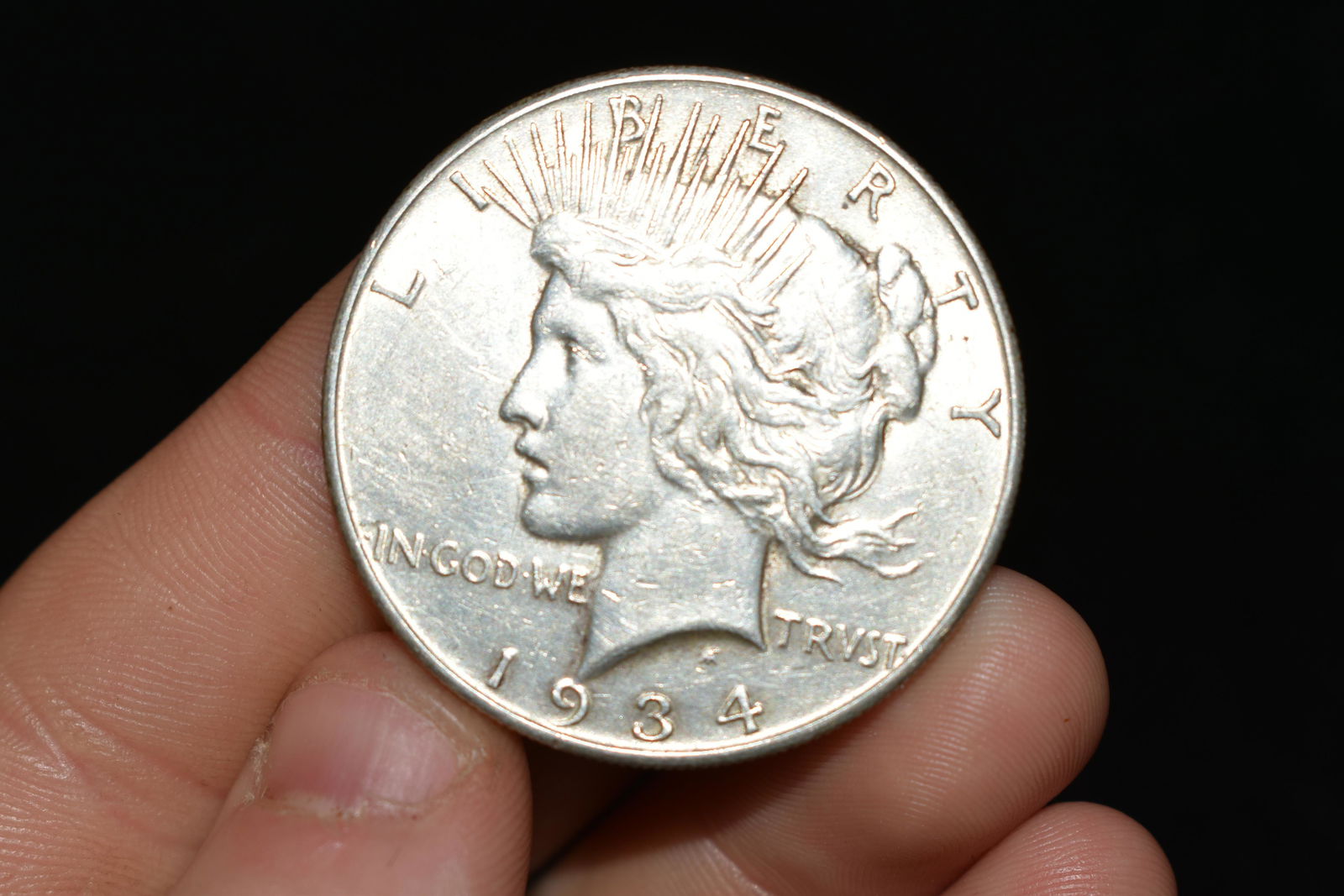 High grade 1934s peace dollar.  Please use photos (1 of 2)