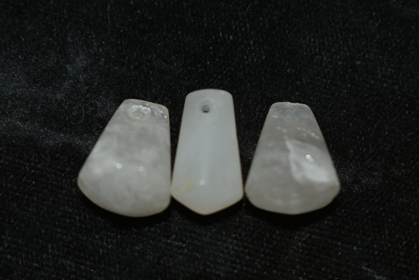 A trio of choice Tairona crystal pendants from Colombia: A trio of choice Tairona crystal pendants from Colombia, ca. 1000 – 1500 AD. Thesebeautiful translucent examples are 5/8” long, are highly polished and drilled for suspension.