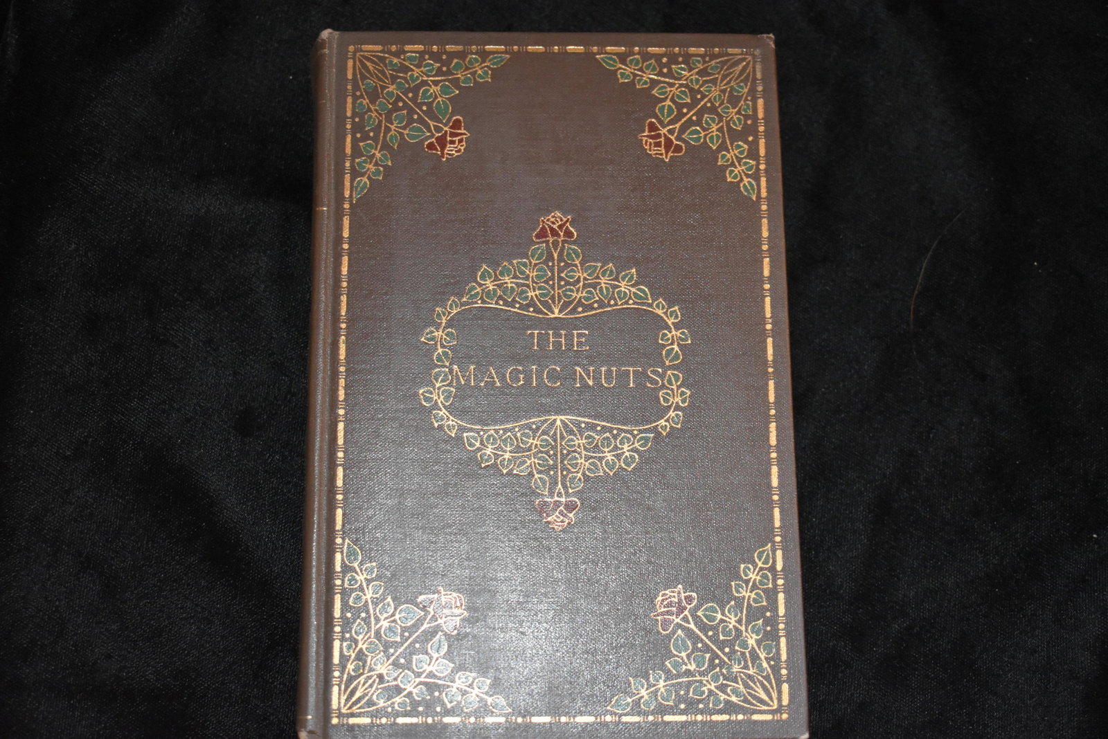 THE MAGIC NUTS by Mrs. Molesworth 1899.: THE MAGIC NUTS by Mrs. Molesworth 1899. Philadelphia: Henry Altemus Company. Fun Fable Gorgeous Victorian Era Book with Original hardback brown cloth, gold and green gilt to cover and spine. Victorian