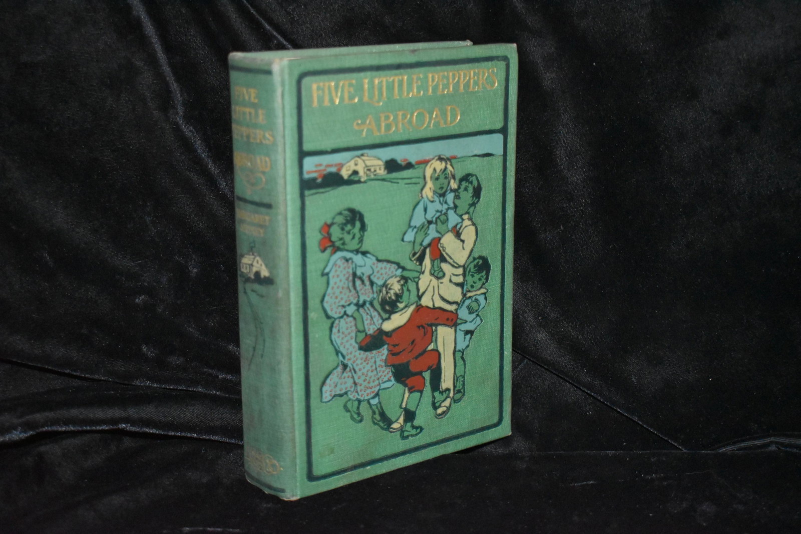 Five Little Peppers Abroad 1st Ed 1902: Five Little Peppers Abroad by Sydney, Margaret. Published by Lothrop Publishing Company, Boston, 1902. 1st Edition. Pictorial green cloth titled in gilt. States Condition Good. Cloth edges rubbed, poi