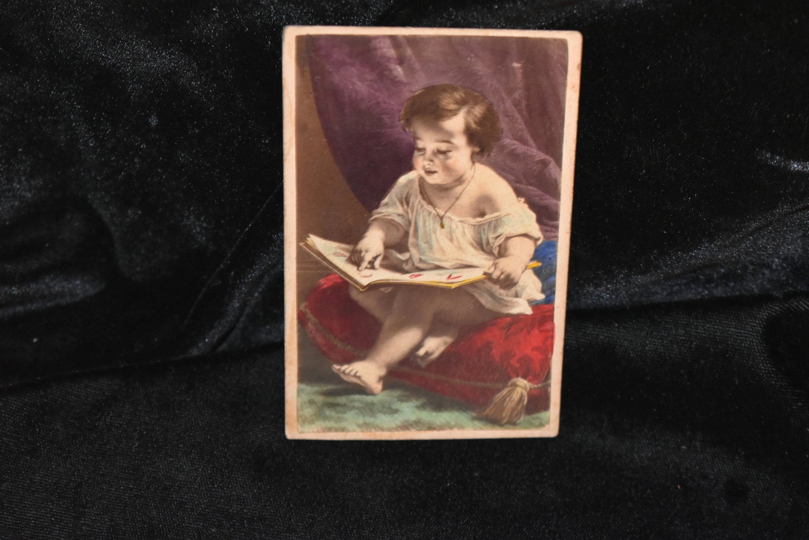 Color CDV Child Reading Civil War Era to 1910: Color CDV Child Reading Civil War Era to 1910. This is an early photo or print of a painting adhered to a card. No Publisher stated on the card. Civil War era to 1910. 3 1/2" by 2 3/8"