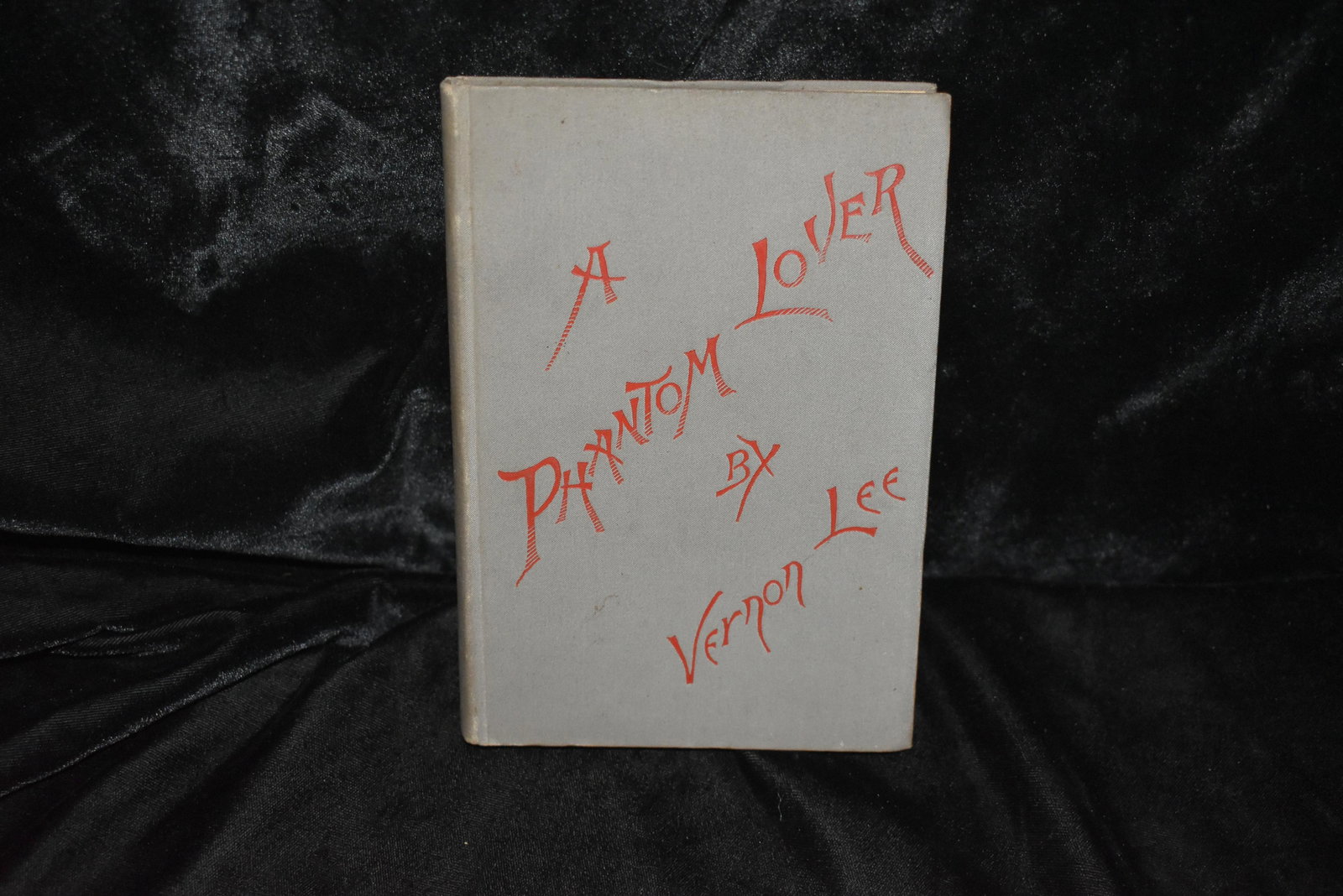 A Phantom Lover by Vernon Lee 1886: A Phantom Lover by Vernon Lee 1886. A Phantom Lover. A fantastic story by Vernon Lee Published in Boston: Roberts Brothers 1886. Hardback in Publishers grey cloth with red embossed cover. Very Good co