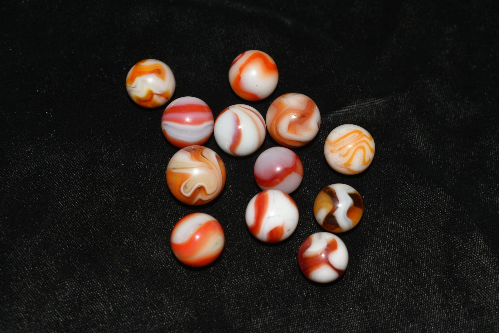 Marbles: 12 Alley Agate Swirls: Marbles: 12 Alley Agate Swirls. Alley Agate 1950's. Lot of 12 marbles. Variety of Alley Agate swirls. 19/32" to 5/8". 1929-1949 very good to excellent condition.