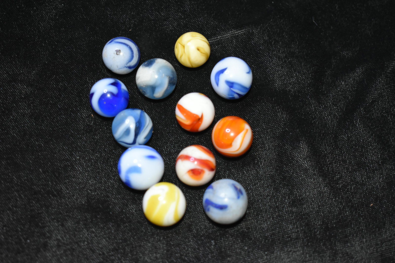 Marbles: 12 Alley Agate Swirls: Marbles: 12 Alley Agate Swirls. Alley Agate 1950's. Lot of 12 marbles. Variety of Alley Agate swirls. 19/32" to 5/8". 1929-1949 very good to excellent condition.