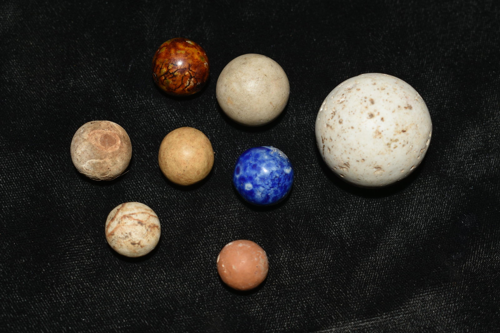 Group of 8 Very Old Marbles: Group of 8 Very Old Marbles 6 Large Clay Marbles and 2 Benningtons. The Large Clay Shooter is just under 1 1/4". The Shooter is kind of heavy for Clay. It may be a very nice Marble that was made by th