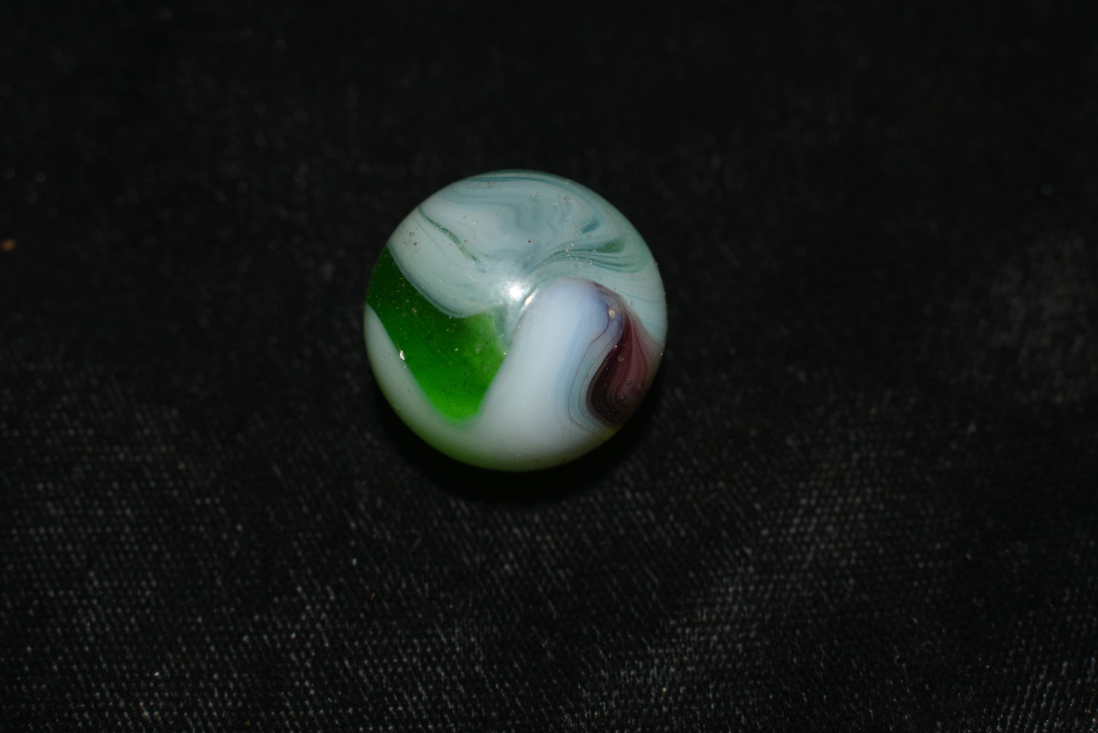 Tri-Color Vitro Swirl Marble: VITRO AGATE COMPANY, Swirl. Opaque white base. Swirls of transparent green with some translucent purple edging. Parkersburg WV, circa 1945-1955. 3/4". Excellent Condition.