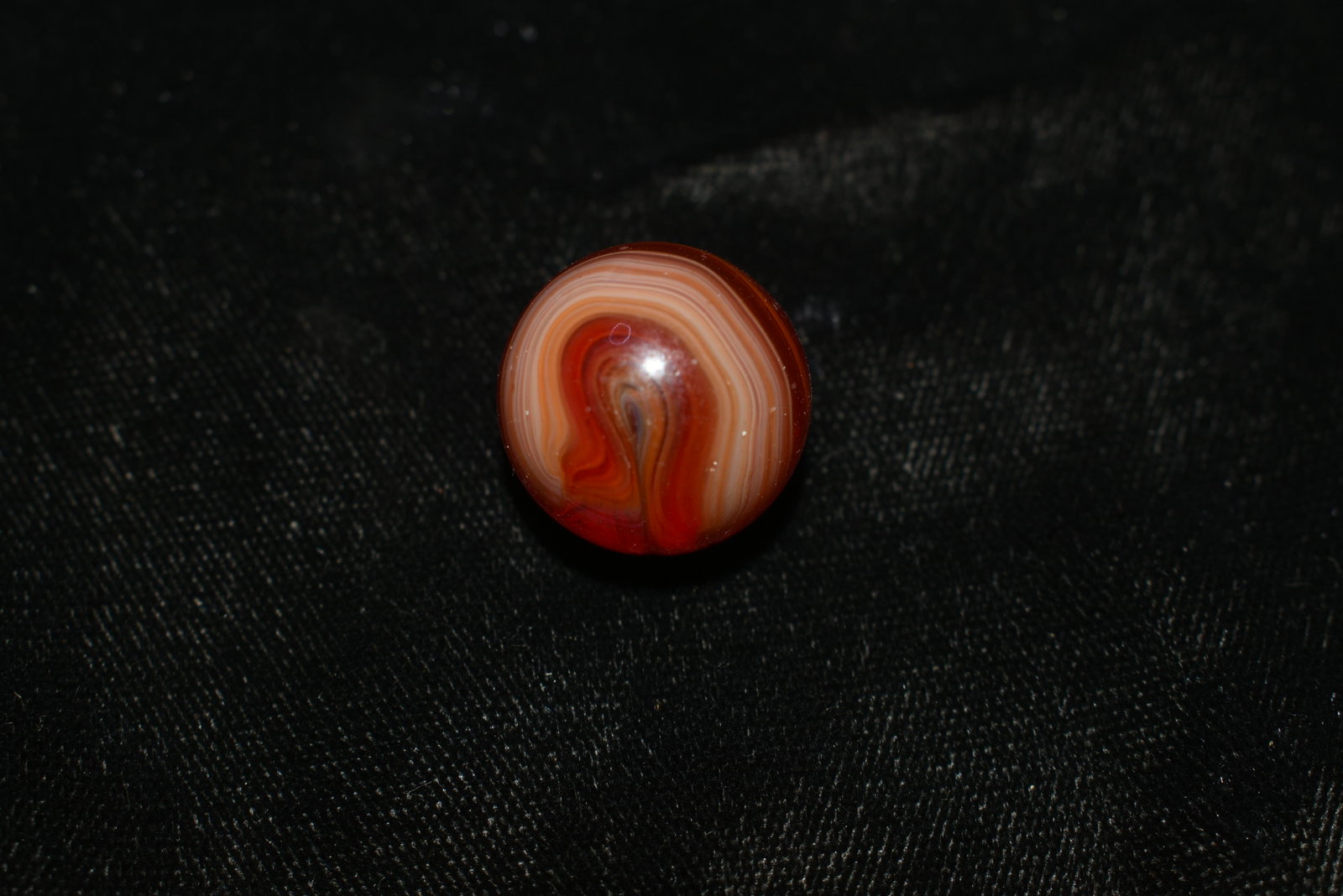 Outstanding Tri-Color Vitro Swirl Marble: Outstanding Tri-Color Vitro Swirl Marble VITRO AGATE COMPANY, Swirl. Opaque white base. Swirls of transparent red with some translucent pink edging. Parkersburg WV, circa 1945-1955. 5/8". Very Good Co