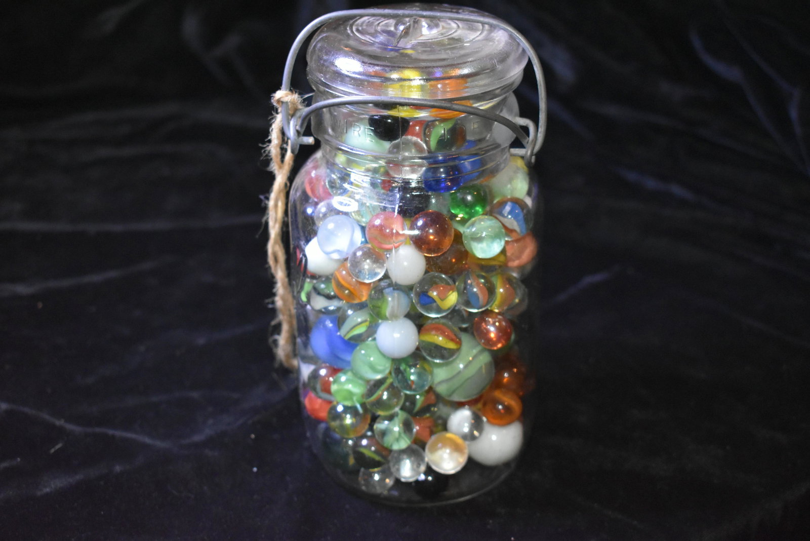 Mason Jar Full of Mostly Old Ribbon Marbles: Mason Jar Full of Mostly Old Ribbon Marbles This jar contains a variety of early ribbon marbles by various makers along with some opaque marbles. Over 200 marbles. A dew are shooters.