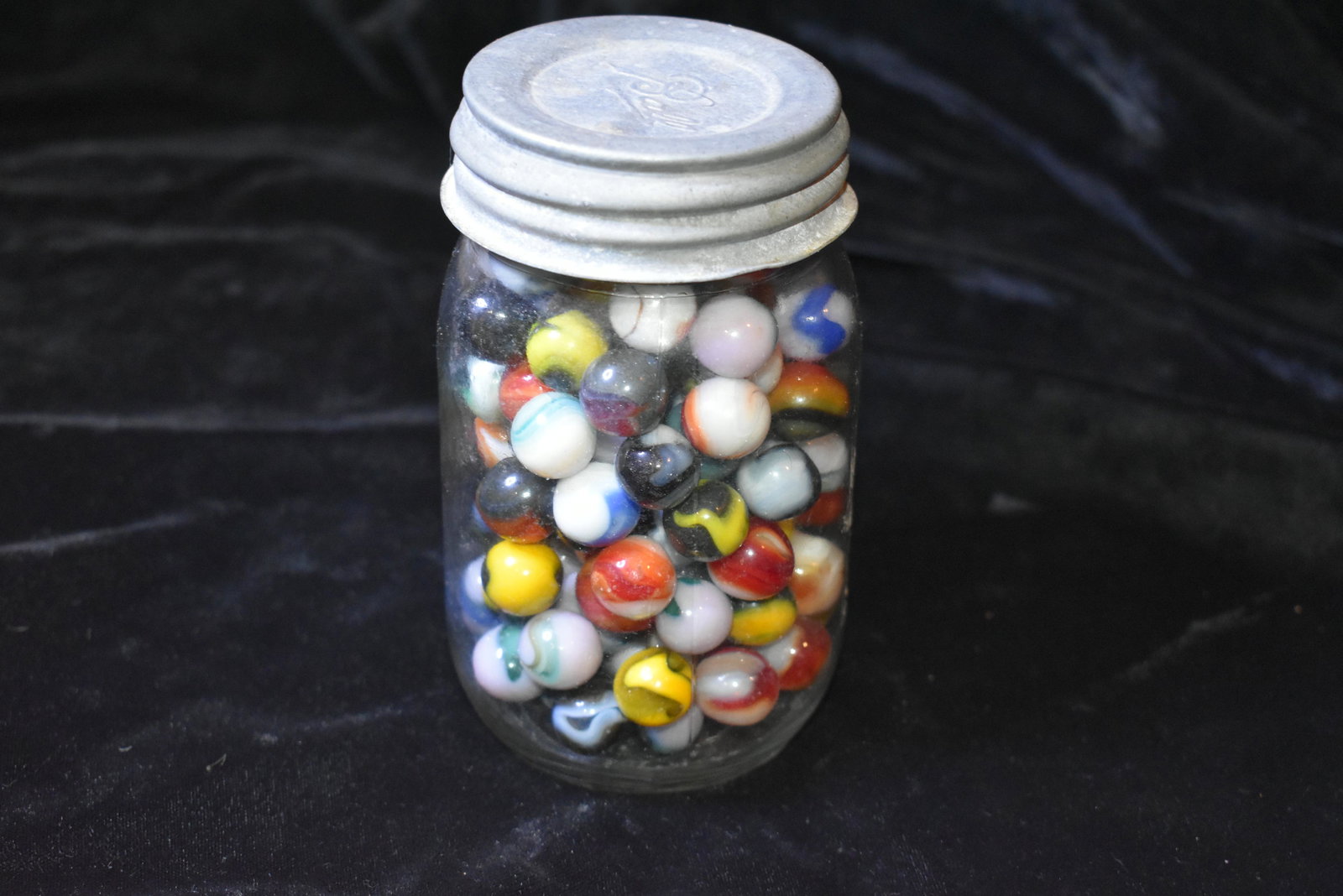 Old Mason Jar Full of Vintage Marbles: Old Mason Jar Full of Vintage Marbles Mason Jar of select colorful marbles from the 1970's-1990's. Over 120 colorful marbles. Most if not all are 5/8" Marbles. All in Excellent condition. Mason Jar is