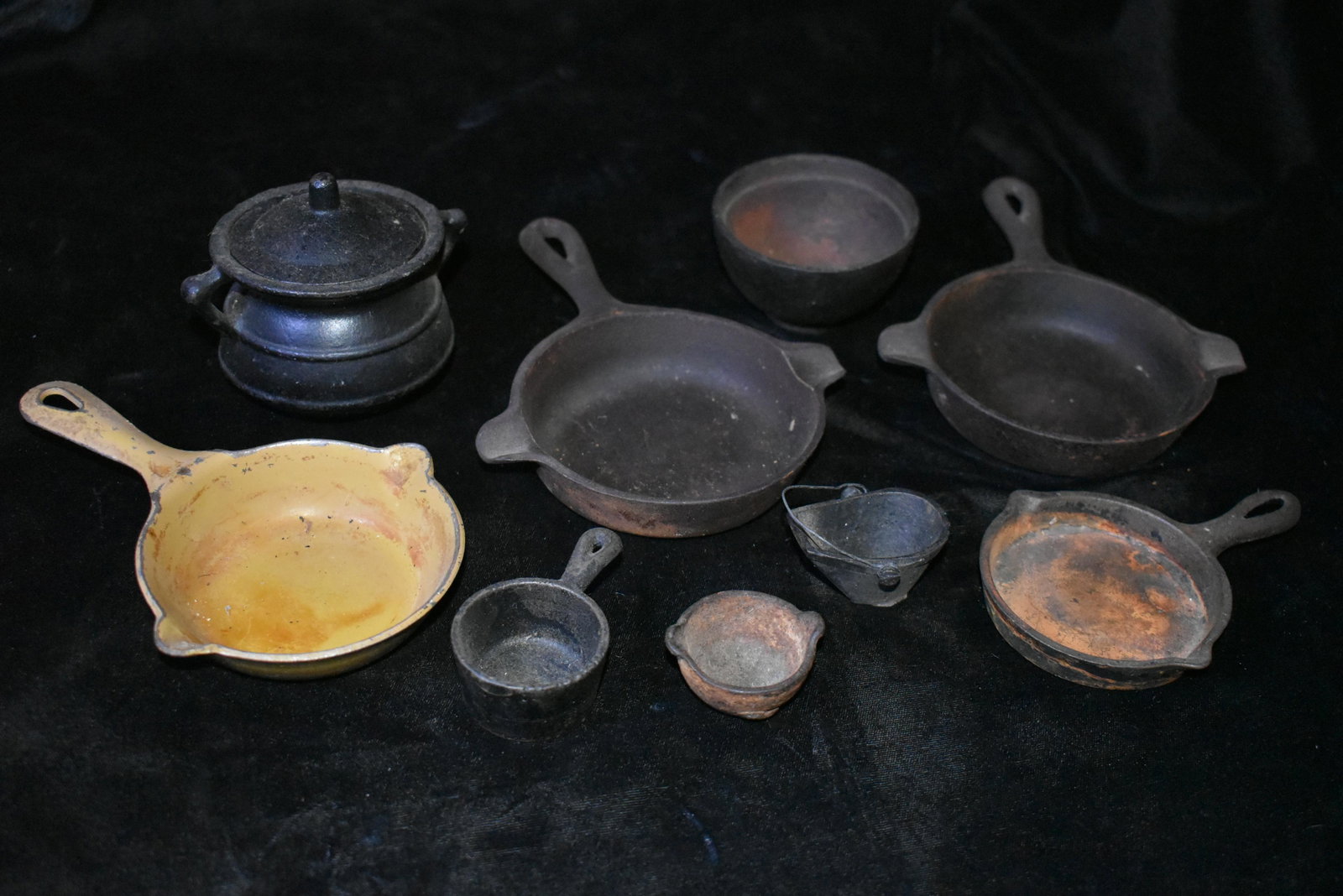 Collection of 9 Antique Cast Iron Minature Cookware: Collection of 9 Antique Cast Iron Minature Cookware, 2 are Wagner Ware 1050B and 1050. The others dont have labels. 1800's to early 1900's. 1 5/8" to 6 1/8" Used as Salesman Samples in ages past.