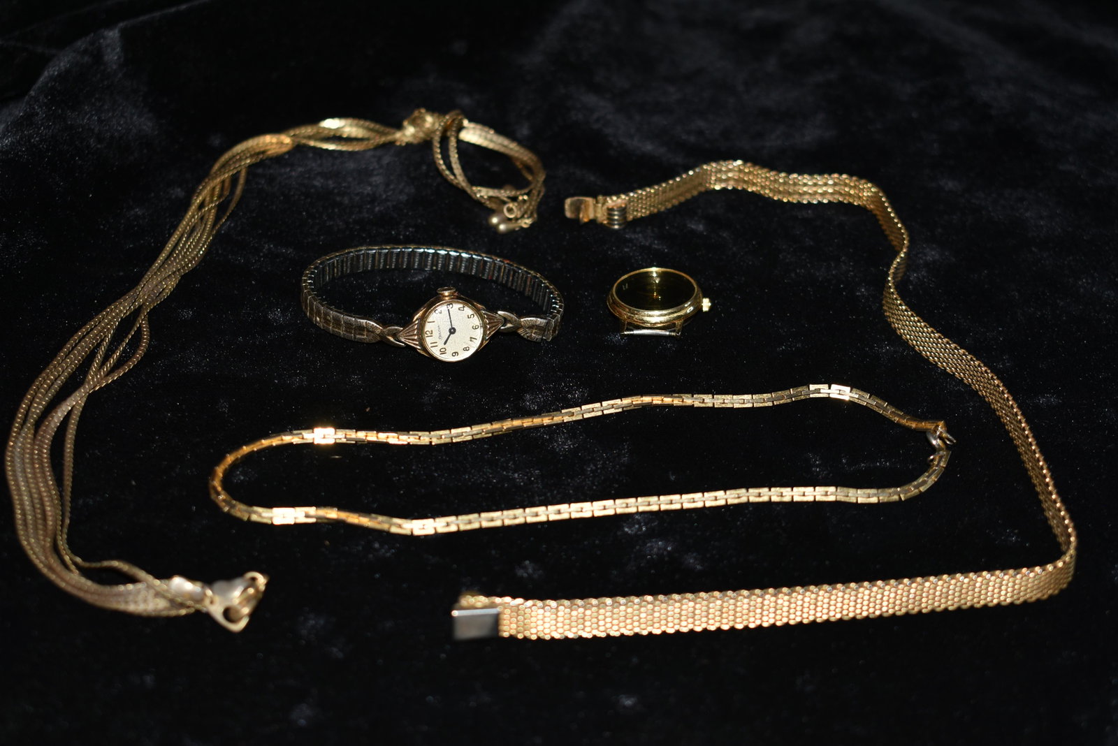 Bulova 10k Gold Watch, 3 Neclaces and Diamond: Bulova Ladies wrist watch in good condition. Still works fine. Bulova 10k R. G. P. Stainless Steel Back. Serial Number r429446. The Chockers appear to be gold in appearance only. The diamond is in the