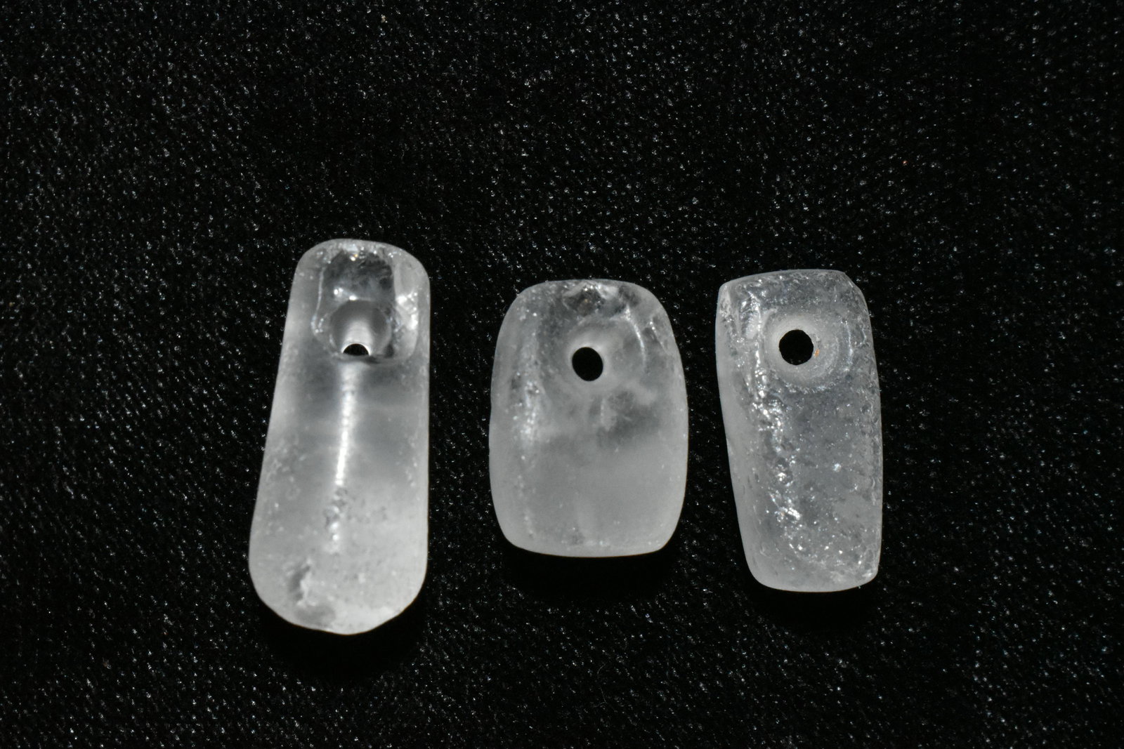 A trio of choice Tairona clear crystal pendants from: A trio of choice Tairona clear crystal pendants from Colombia, ca. 1000 â€“ 1500 AD. These beautiful translucent examples are 5/8” long, are highly polished and drilled for suspension.