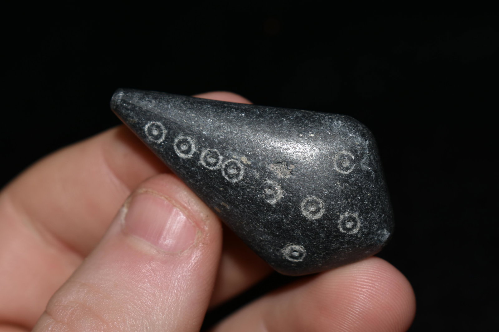 A choice Late Roman â€“ Early Byzantine pendant, ca.: A choice Late Roman â€“ Early Byzantine pendant, ca. 5th - 7th Century AD. It is 1-3/4 inches long, is made from nicely polished stone and is decorated with incised circular designs in the form o