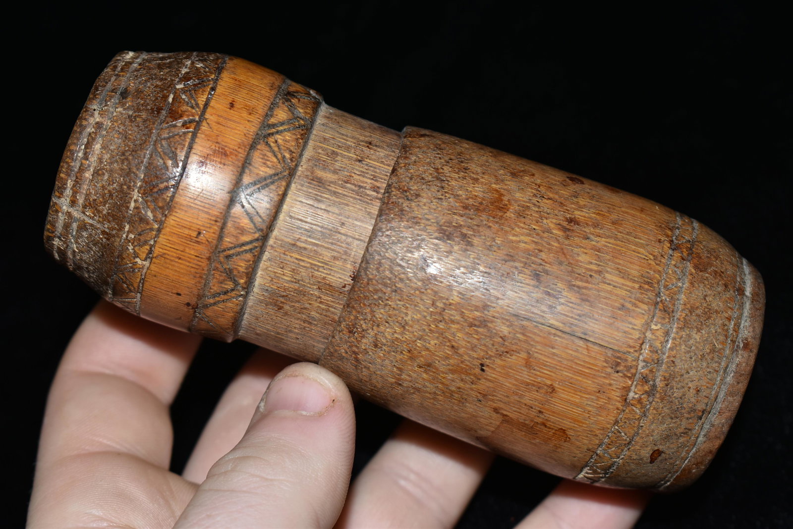 A well-used medicine container from Timor, ca. late: A well-used medicine container from Timor, ca. late 1800â€™s, made from two perfectly fitting sections of bamboo. It is 4-1/2” high and is nicely decorated with bands of intricately incised