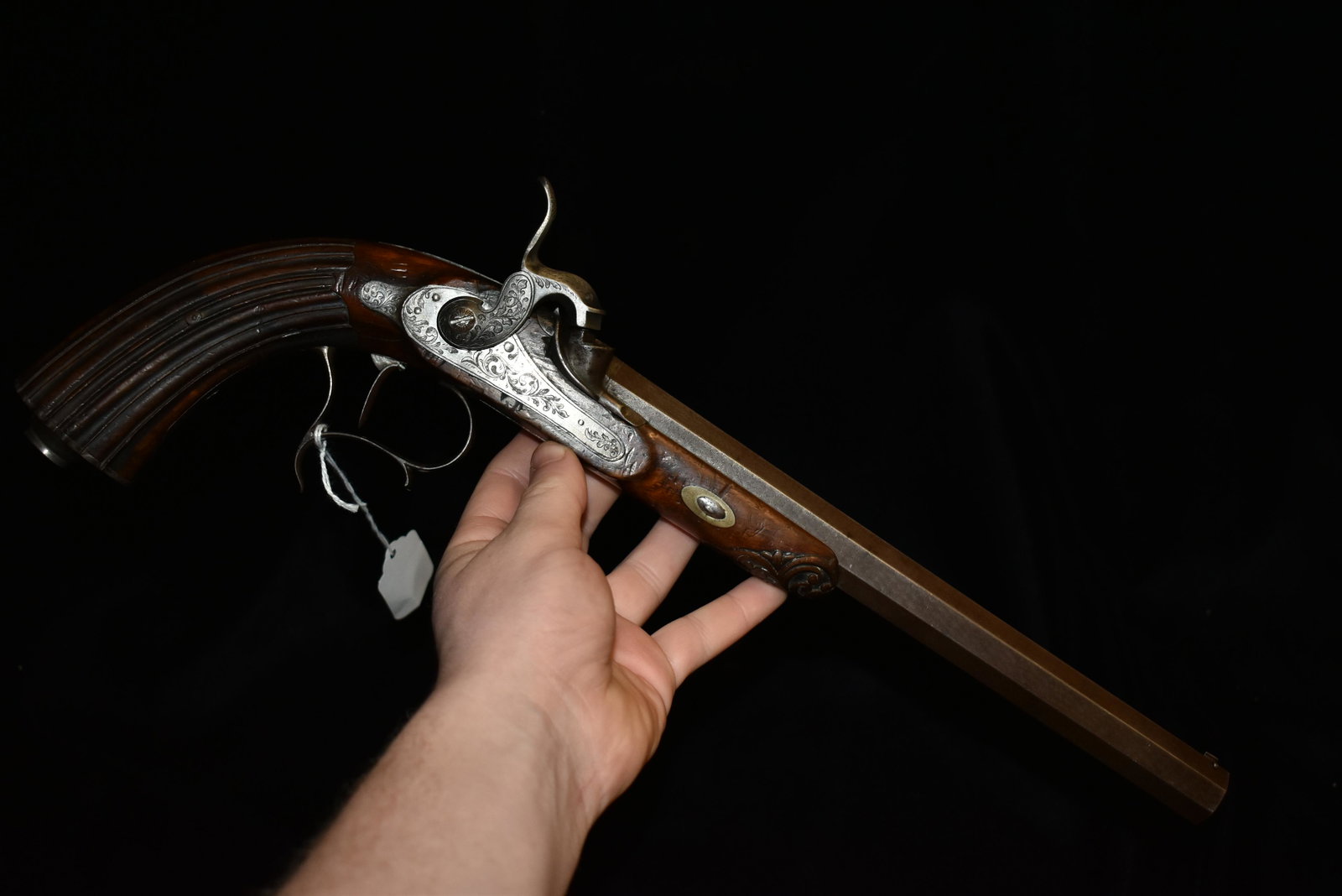 Great factory engraved early 1800's percussion pistol.: Great factory engraved early 1800's percussion pistol. Great original as found condition. Nicely carved handle. Belgium made dueling or target pistol. 50 caliber. Octagonal barrel. Walnut stock.