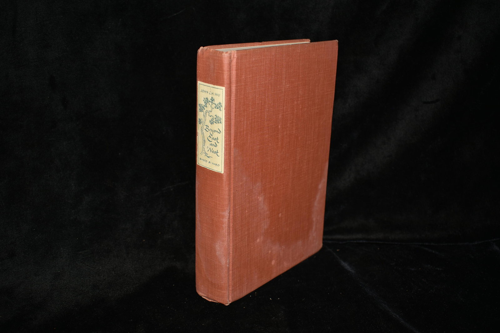 1941 Beyond East and West 1st Edition: Beyond East and West by John C.H. Wu. Published by Sheed & Ward, London 1951. 1st Edition. Very Good condition. Minor shelf wear. Publishers original pink cloth hardback with decorative name plate to