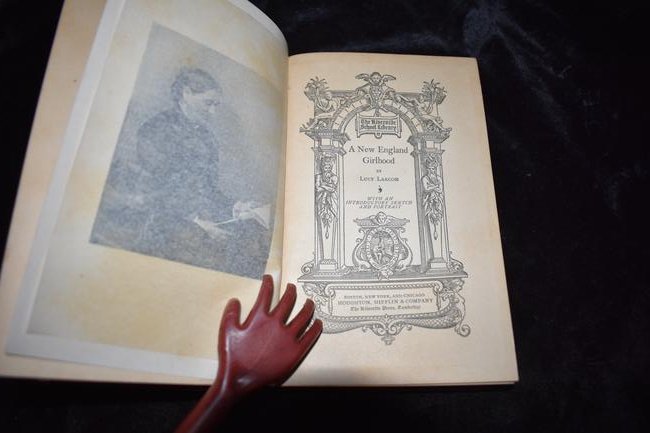 1889 A New England Girlhood 1st Edition: A New England Girlhood by Lucy Larcom. Published by Houghton Mifflin & Co., Boston (1889). 1st edition. Publishers hardback with leather spine and purple cloth boards. Gold gilt to spine. Top and bott