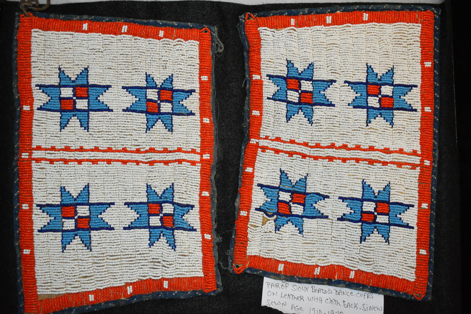 Pair of Sioux beaded dance cuffs on leather with cloth (1 of 5)