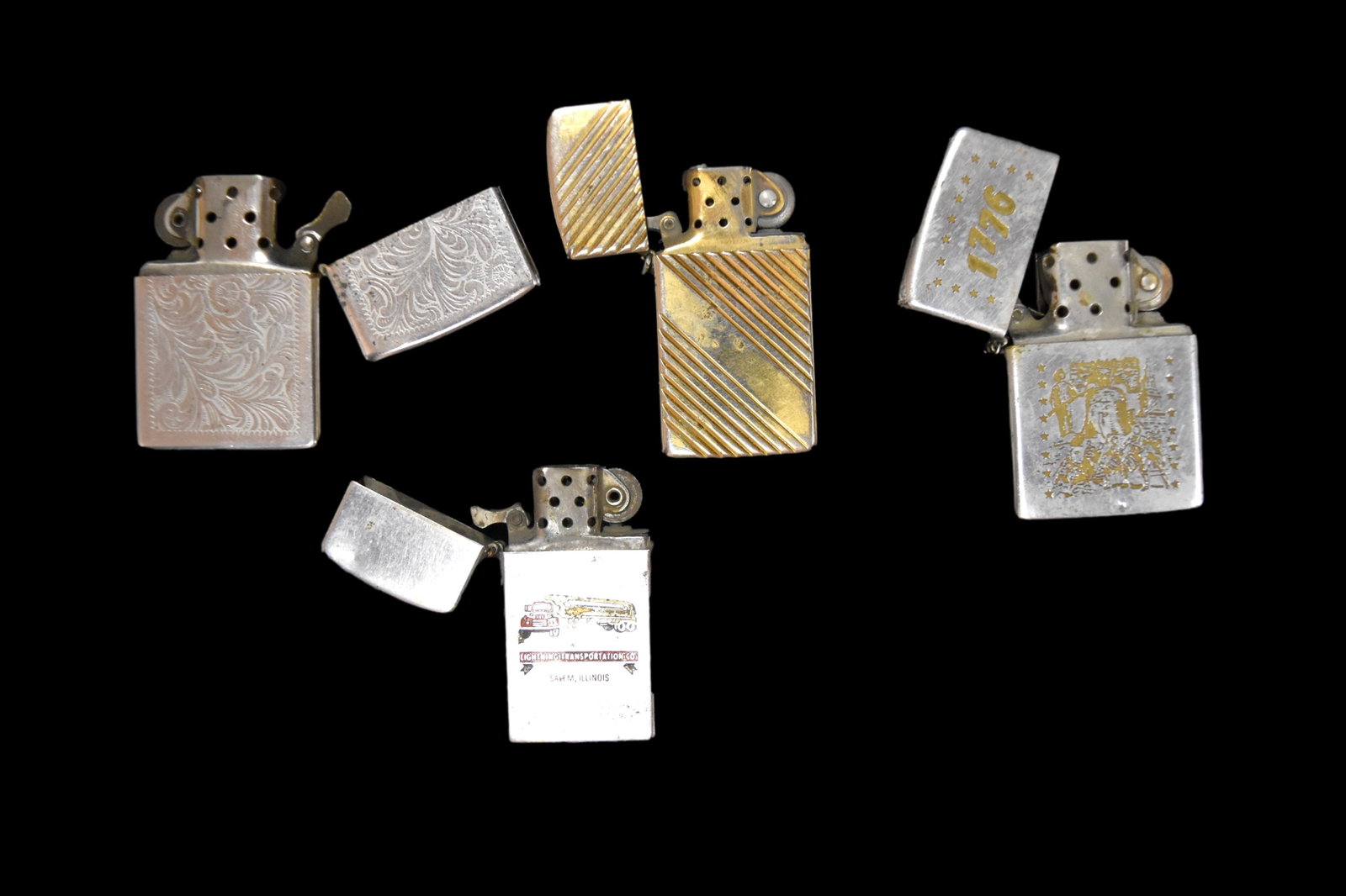 4 vintage Zippo lighters. Some with advertising and: 4 vintage Zippo lighters. Some with advertising and decoration.