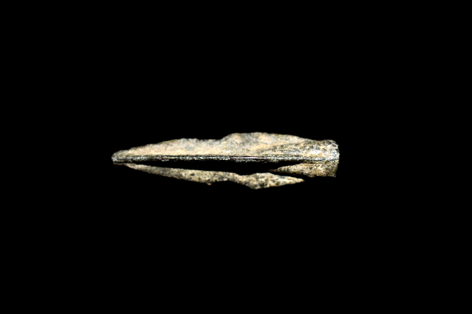 Scythian Trilobite Arrowhead; Central Asia, 750-350 BC: A fine Scythian trilobite arrowhead from Central Asia, ca. 750 â€“ 350 BC. This excellent bronze example is 1-1/2” long, has a hollow socket and good mineral deposits.