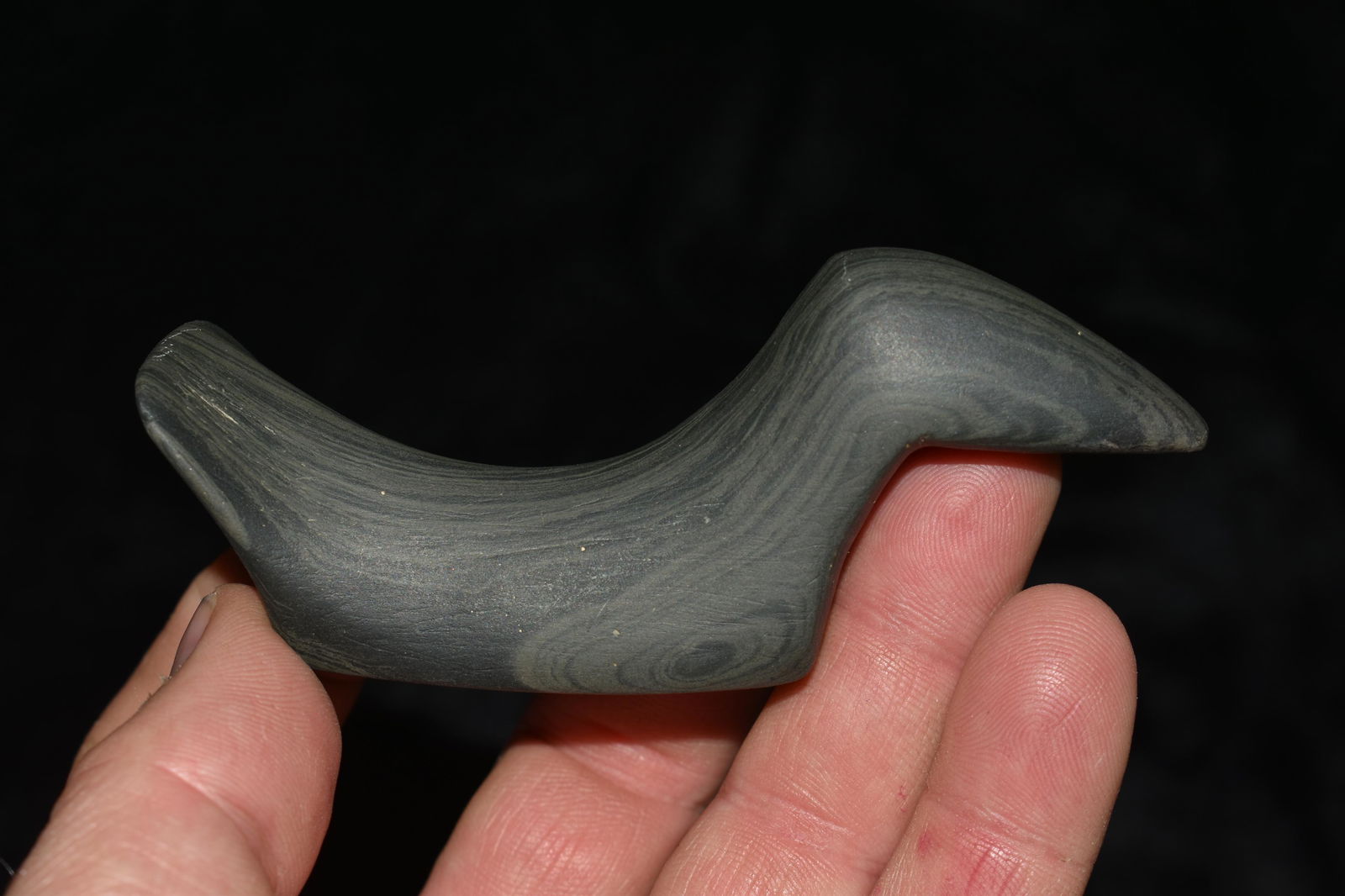 3 13/16 Birdstone Made of Banded Slate. Ex Earl: 3 13/16 Birdstone Made of Banded Slate. Ex Earl Townsend. Pictured in Whos Who 5 and 10 in Earls Collection. 1/4" Restoration to the beak. Ex Keith Baranski, Dick Coulter, Bob Converse, Gilbert Cooper