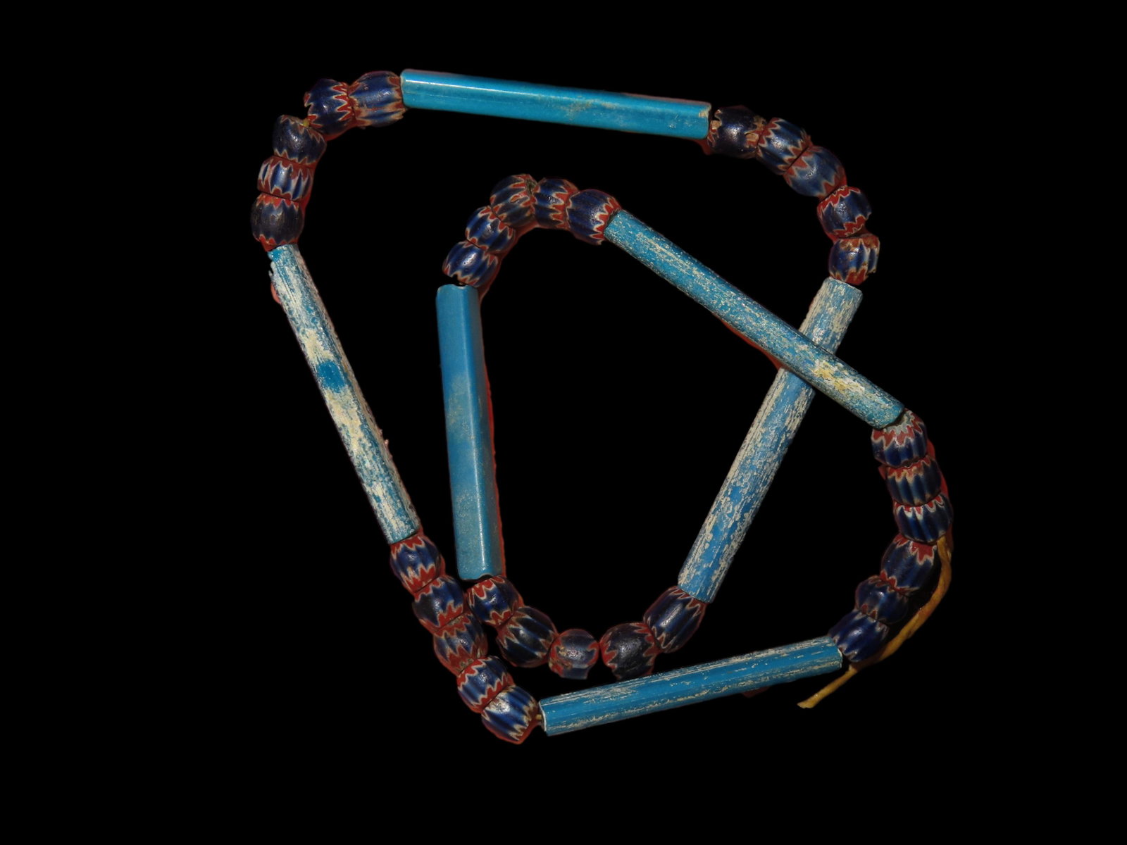 19" Strand of Tiny Chevron Style Dark Blue & Red Trade Beads, and Long Bright Blue Trade Beads, Ex: 19" Strand of Tiny Chevron Style Dark Blue & Red Trade Beads, and Long Bright Blue Trade Beads, Ex Greg Perdun, Ex Mitch Lewis
