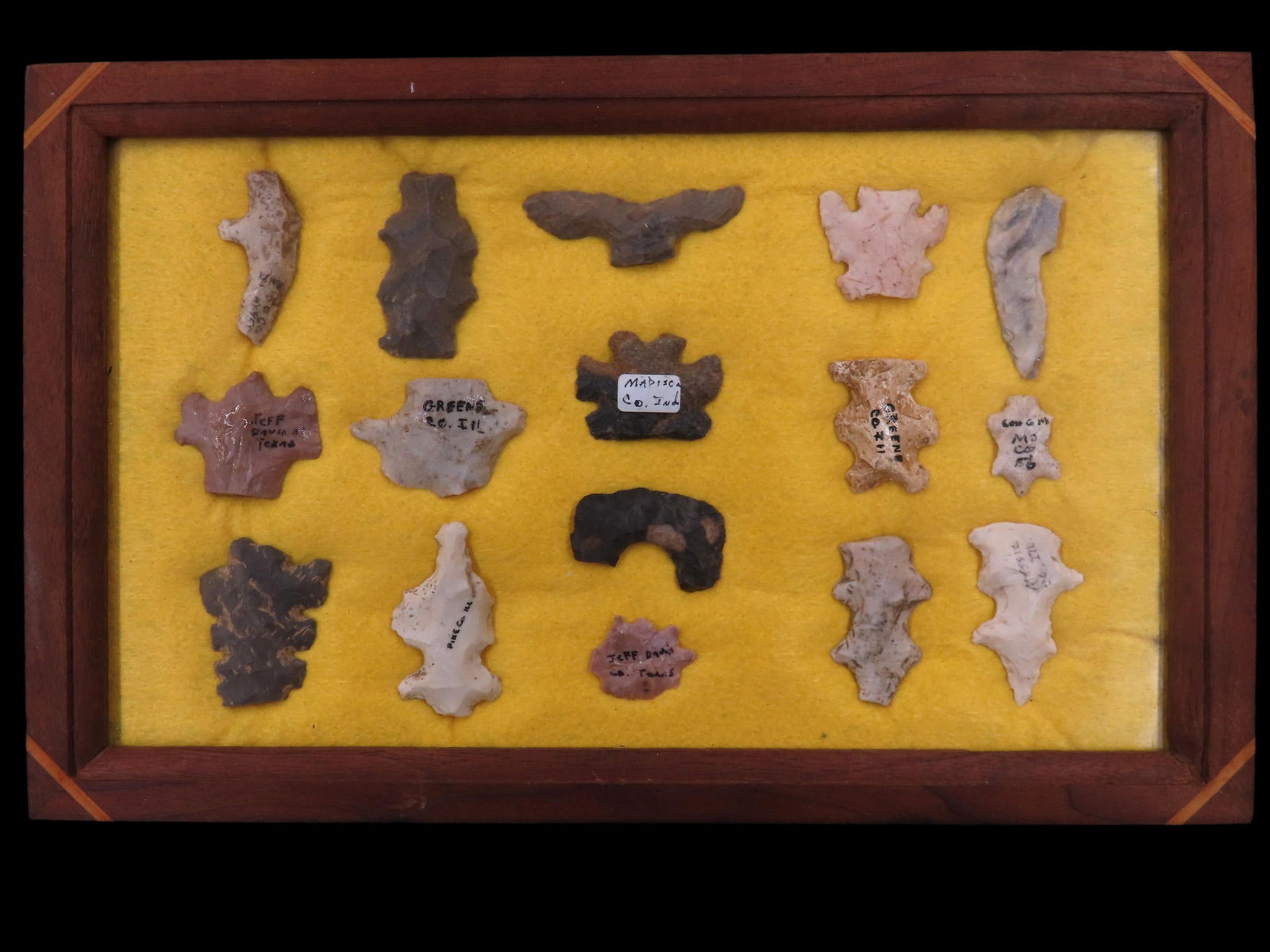 Frame containing 16 flint eccentric / effigy points from the Midwest, frame is 12x7.1/2" (1 of 20)