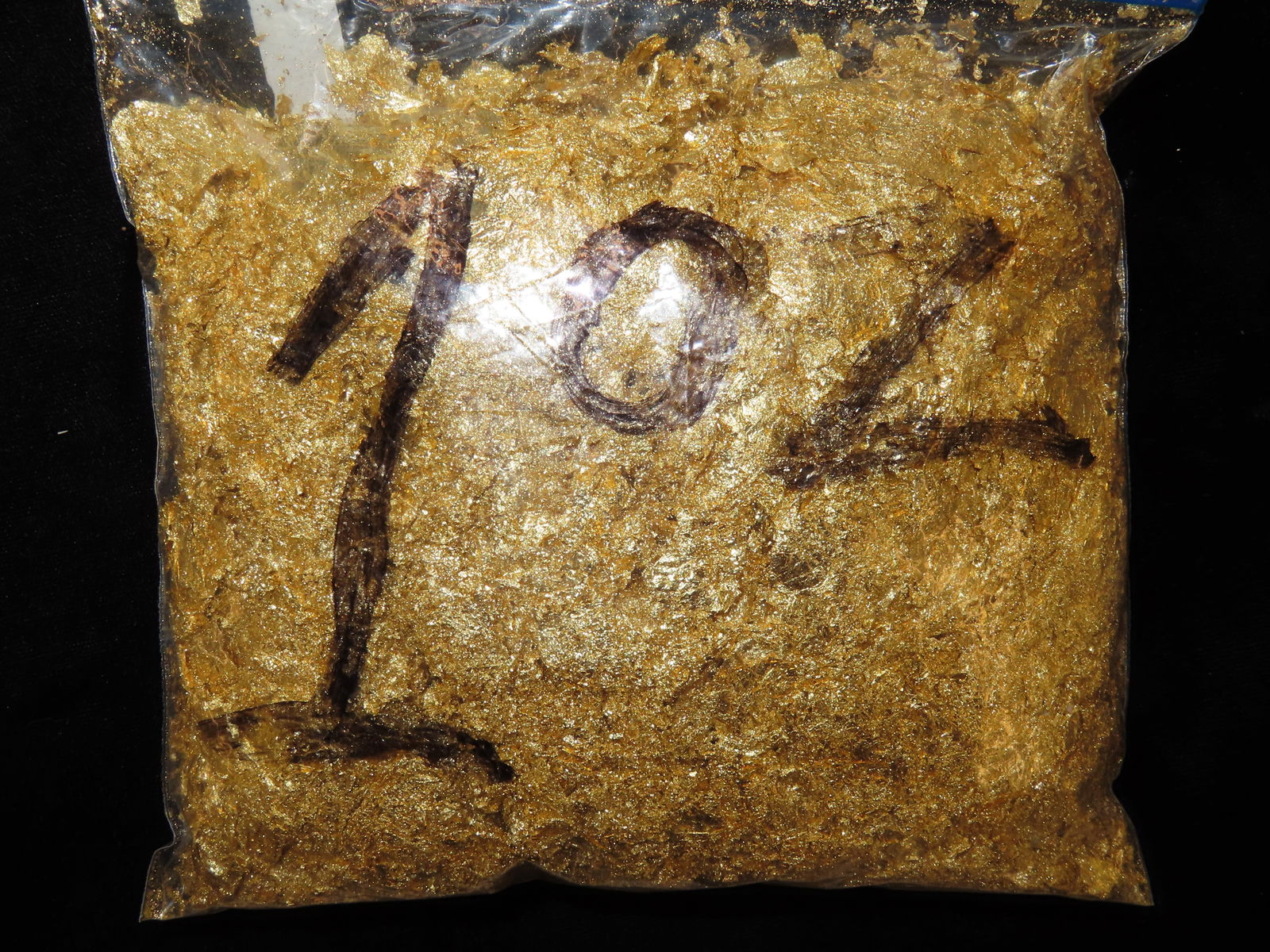 1 ounce of Gold Flake, Field Test Positive for 10-18 Caret (1 of 2)