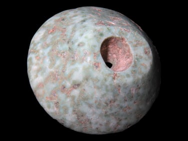 Maya Ear Spool. Mexico, Pre-Columbian. Speckled greenstone, 1 5/8", ex Dr Harner