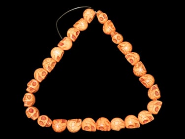 16" Strand of Rust Color Skull Beads